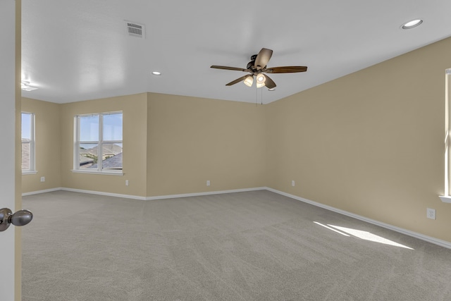 unfurnished room with light carpet and ceiling fan