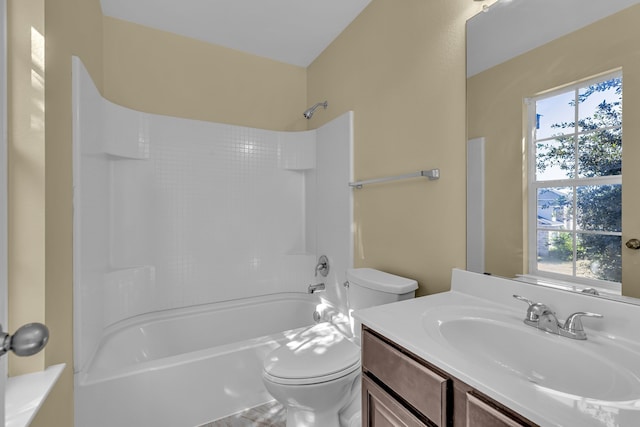 full bathroom with vanity, bathing tub / shower combination, and toilet