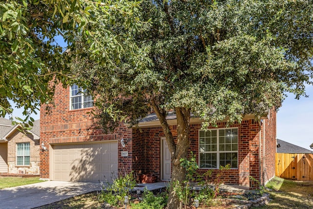 obstructed view of property with a garage