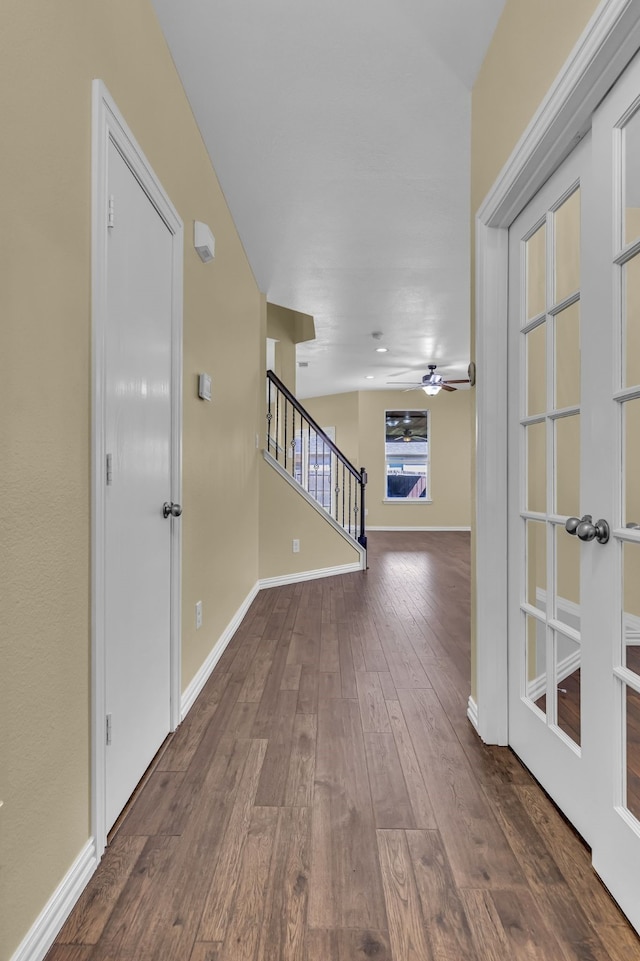 hall with dark hardwood / wood-style flooring