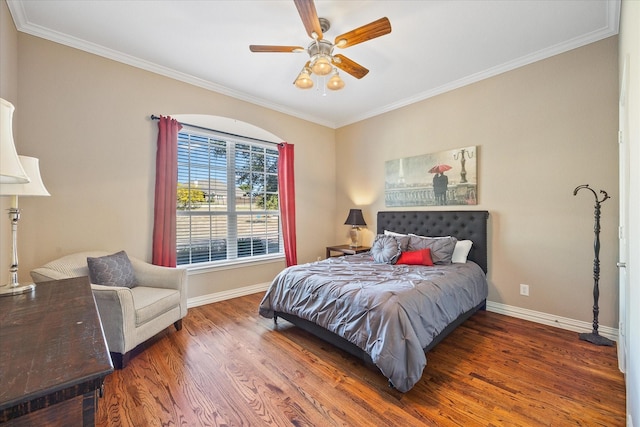 bedroom with baseboards, wood finished floors, a ceiling fan, and ornamental molding