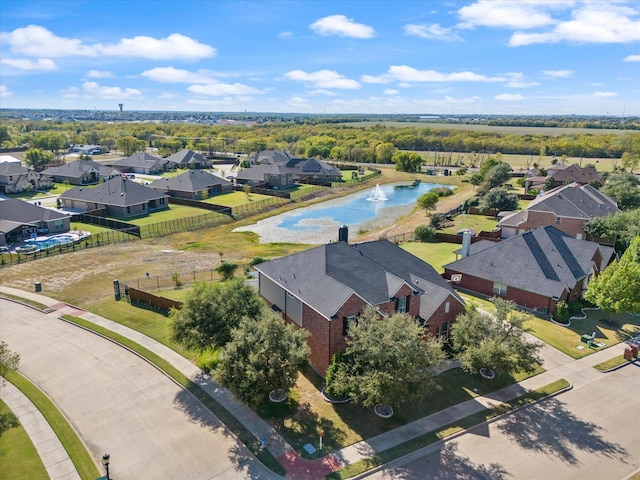 aerial view with a residential view and a water view