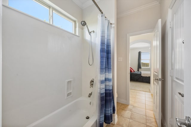 bathroom with shower / tub combo with curtain, a healthy amount of sunlight, tile patterned flooring, and ornamental molding