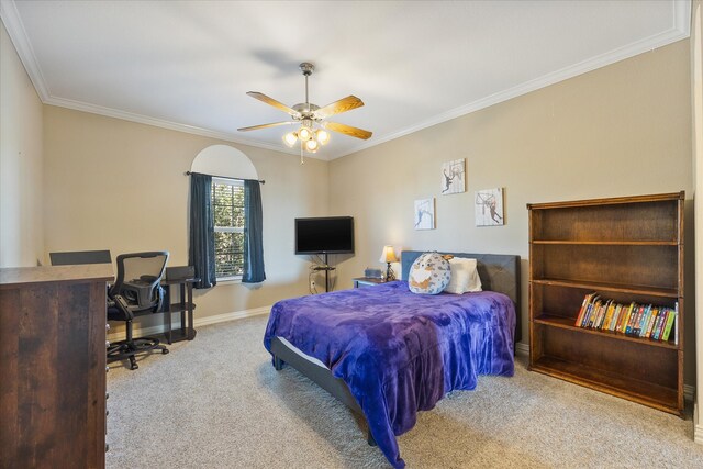 bedroom featuring light carpet, ornamental molding, and ceiling fan