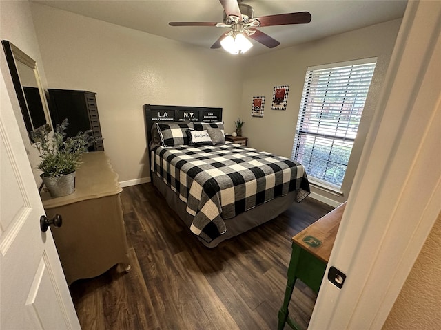 bedroom with ceiling fan and dark wood-type flooring