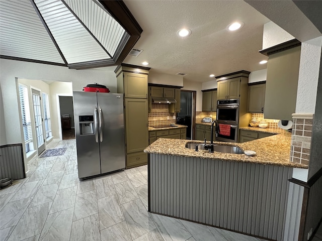 interior space featuring white cabinetry and sink