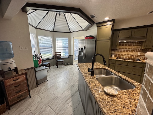 unfurnished living room featuring vaulted ceiling with beams and ceiling fan