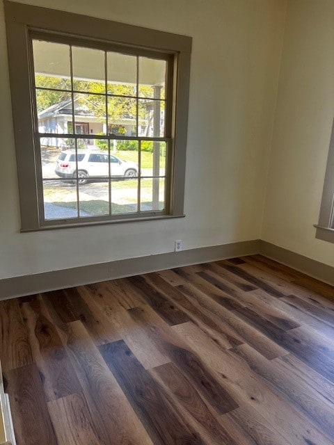 unfurnished room featuring wood-type flooring