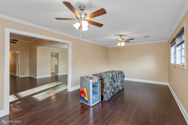 living area featuring crown molding, dark hardwood / wood-style floors, a textured ceiling, and ceiling fan