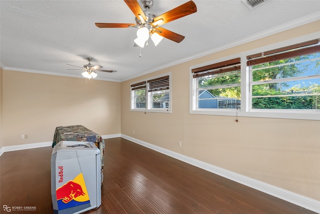 playroom with ceiling fan, crown molding, a textured ceiling, and dark hardwood / wood-style floors