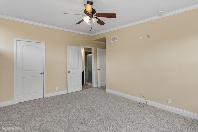 unfurnished bedroom featuring crown molding, carpet flooring, and ceiling fan