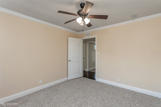 unfurnished room featuring ornamental molding, carpet floors, and ceiling fan