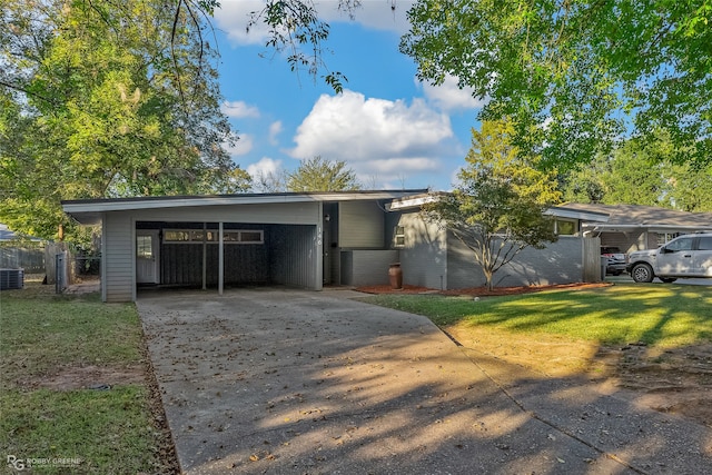 single story home with a front yard, central AC, and a carport