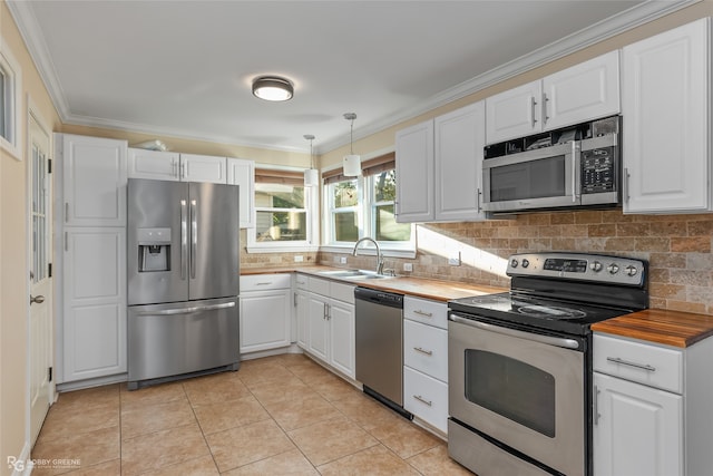 kitchen featuring white cabinets, backsplash, sink, pendant lighting, and stainless steel appliances