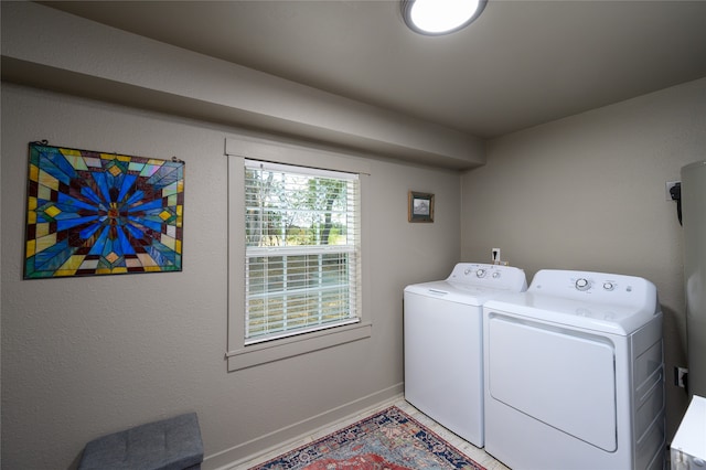 laundry room with washing machine and dryer