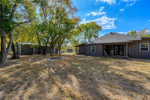 view of yard with an outdoor fire pit and a patio area