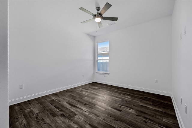 empty room with dark hardwood / wood-style floors and ceiling fan