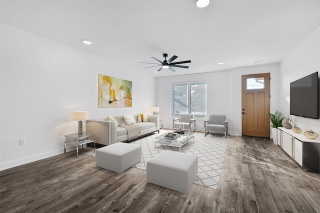 living room with dark hardwood / wood-style floors and ceiling fan