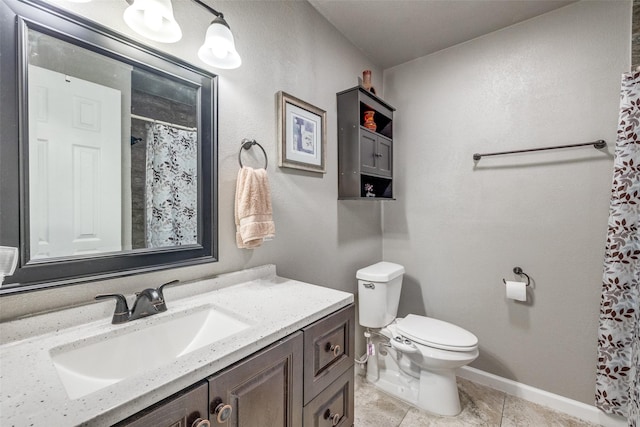 bathroom featuring vanity, toilet, and walk in shower