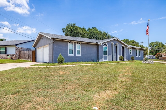 single story home with a front yard and a garage