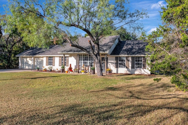 view of front facade with a front yard and a garage