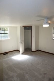 unfurnished bedroom with carpet flooring and ceiling fan