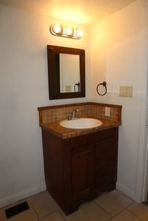 bathroom with tile patterned floors and vanity