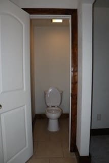 bathroom with tile patterned floors and toilet