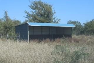 view of pole building with a detached carport