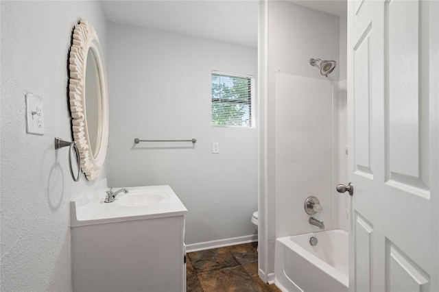 full bathroom featuring toilet, vanity, and tub / shower combination