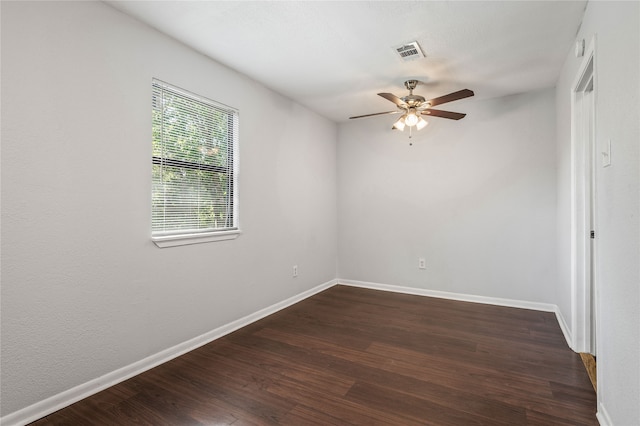 unfurnished room with ceiling fan and dark hardwood / wood-style flooring