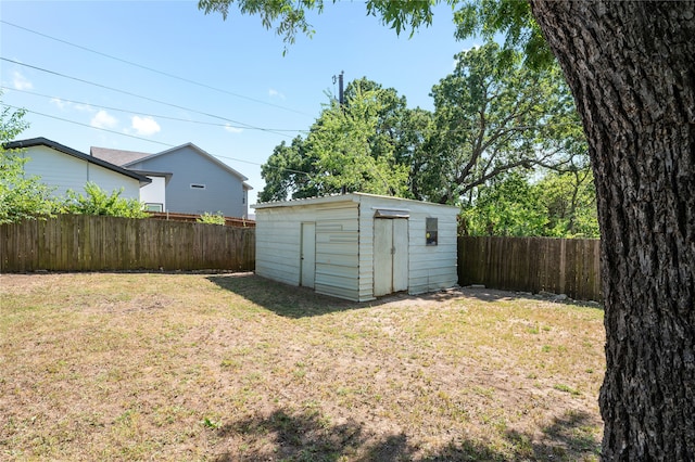 view of outbuilding with a lawn