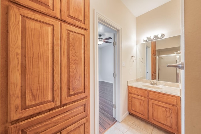 bathroom featuring vanity, a shower with door, and tile patterned floors