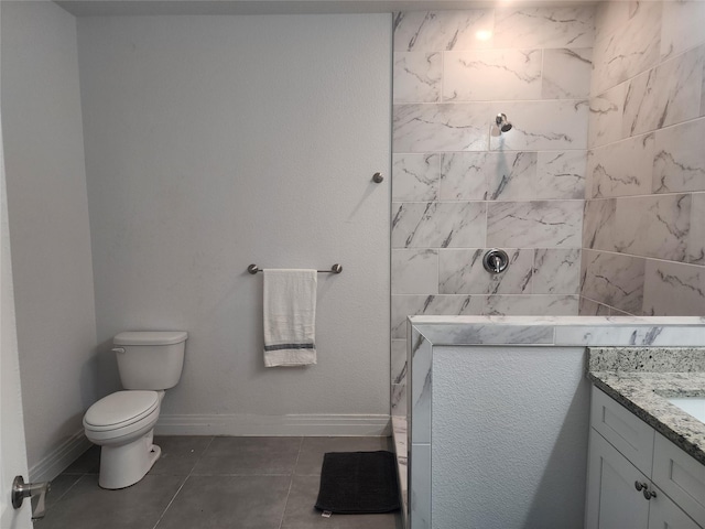 bathroom with a walk in shower, tile patterned floors, toilet, and vanity