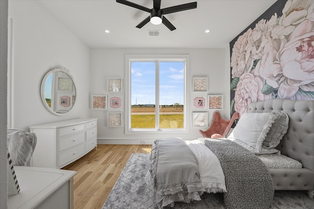 bedroom featuring light hardwood / wood-style flooring and ceiling fan