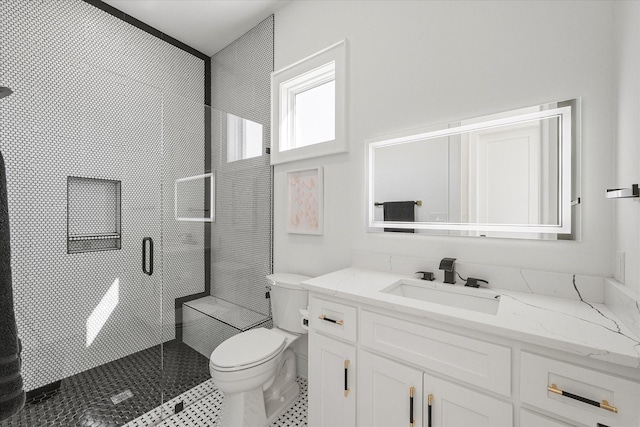 full bath with toilet, a shower stall, and vanity