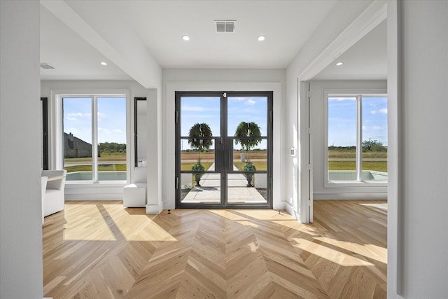 doorway with light parquet floors