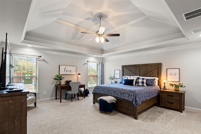 bedroom featuring a raised ceiling, light carpet, ceiling fan, and crown molding