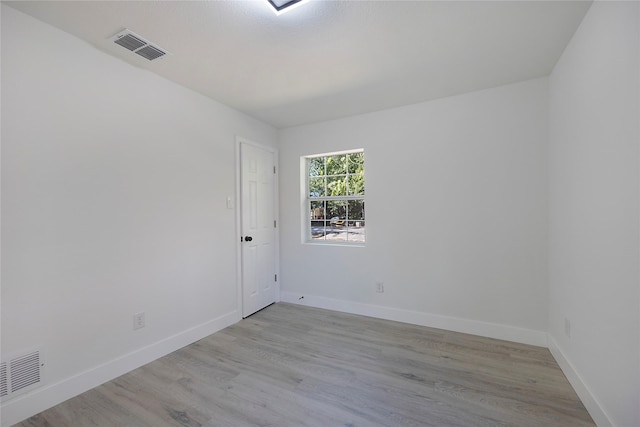 unfurnished room featuring light hardwood / wood-style flooring