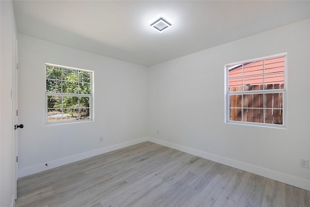 spare room featuring light hardwood / wood-style floors