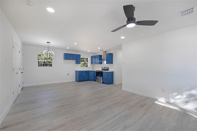 unfurnished living room with ceiling fan and light hardwood / wood-style floors