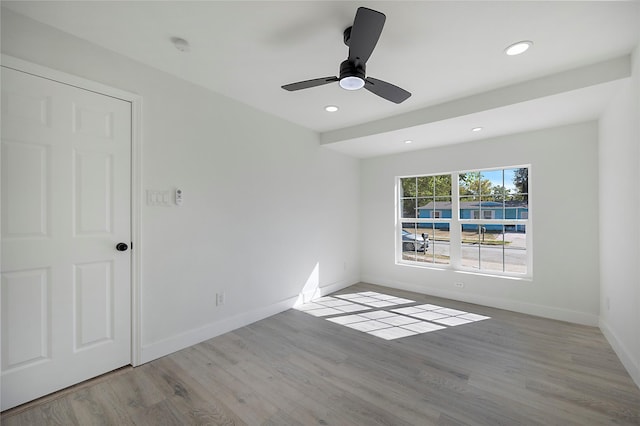 unfurnished room featuring light hardwood / wood-style floors and ceiling fan