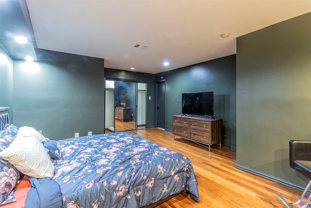 bedroom featuring a closet and hardwood / wood-style floors