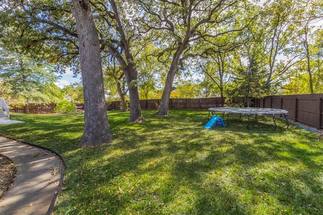 view of yard with a trampoline