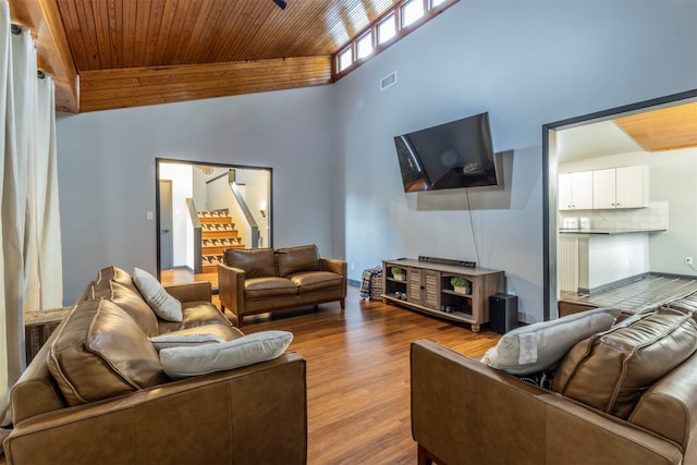 living room with wood ceiling, high vaulted ceiling, and light hardwood / wood-style floors