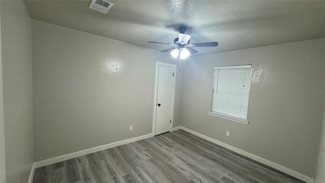 unfurnished room featuring wood-type flooring and ceiling fan