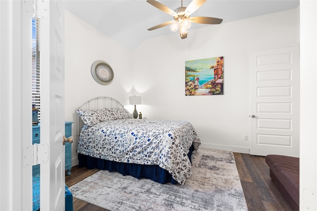 bedroom featuring ceiling fan, lofted ceiling, and dark hardwood / wood-style flooring