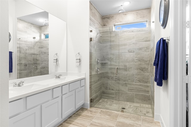 bathroom featuring vanity and an enclosed shower