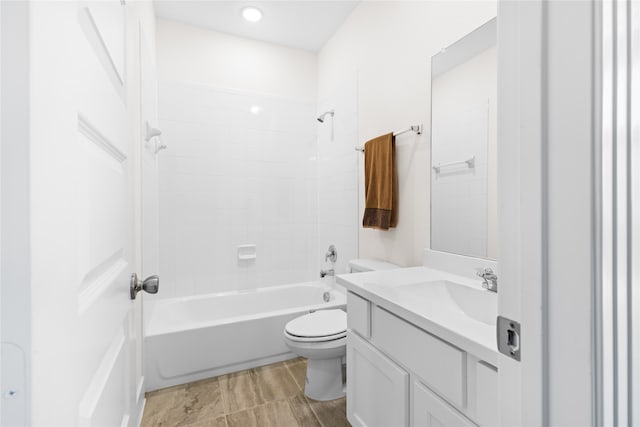 full bathroom with vanity, toilet, and tiled shower / bath combo