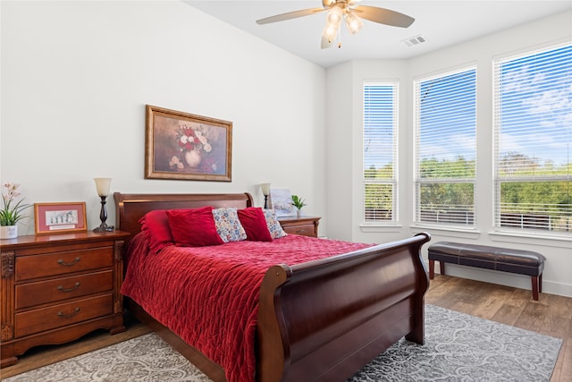 bedroom with ceiling fan and light hardwood / wood-style flooring